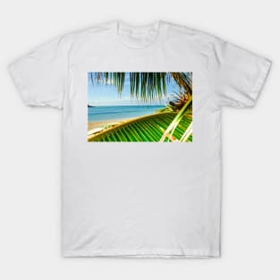 Tropical beach scene with palm fronds. T-Shirt